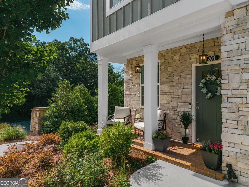 Welcome to Lakeside Garden, a truly one-of-a-kind townhome in - photo 2
