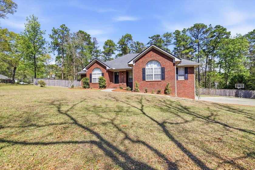 Welcome to this picture-perfect, corner lot brick beauty, in the - photo 3