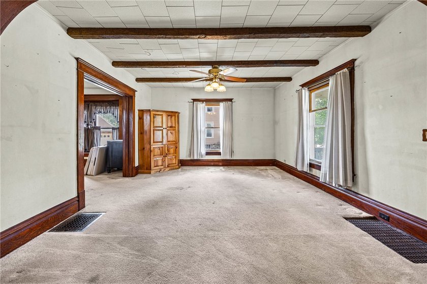 Discover the timeless charm of this 1900s home, rich with - photo 6