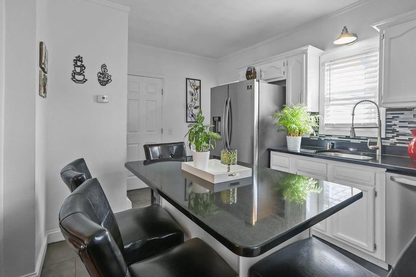 Welcome to this charming single-family home nestled on an - photo 2