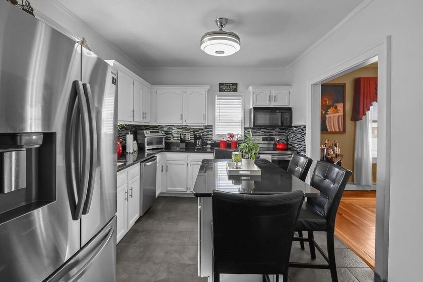 Welcome to this charming single-family home nestled on an - photo 3