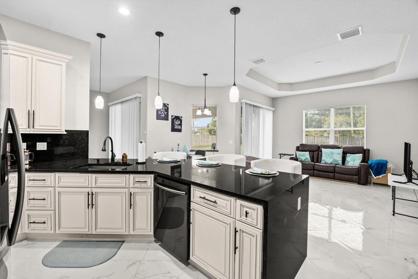 Welcome to this thoughtfully designed single-story residence in - photo 13