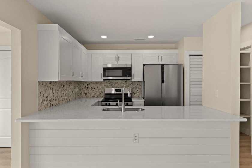 Lake front! This freshly updated condo offers a comfortable and - photo 9