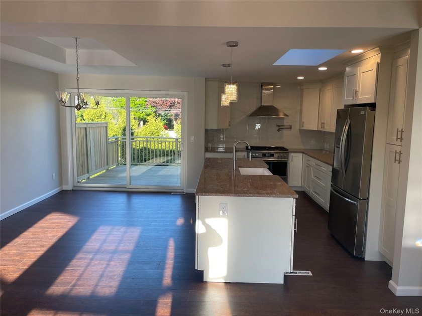 Welcome to your renovated 4-bedroom High Ranch with a bonus room - photo 3