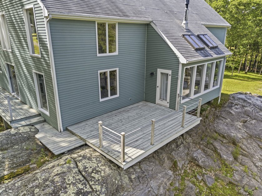 Nestled along the shore of the Kennebec River, this private 3BR - photo 18