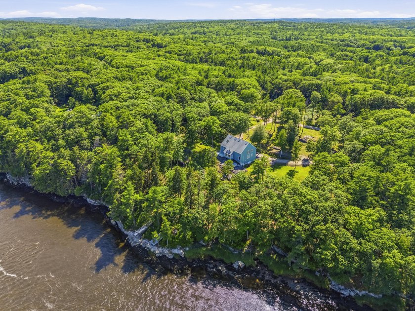 Nestled along the shore of the Kennebec River, this private 3BR - photo 27