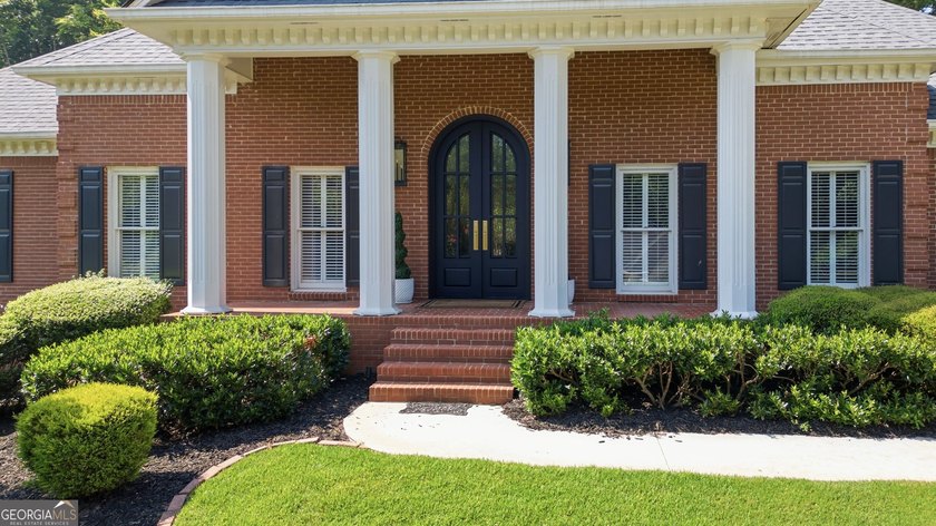 Discover this beautifully renovated ranch home in the highly - photo 2