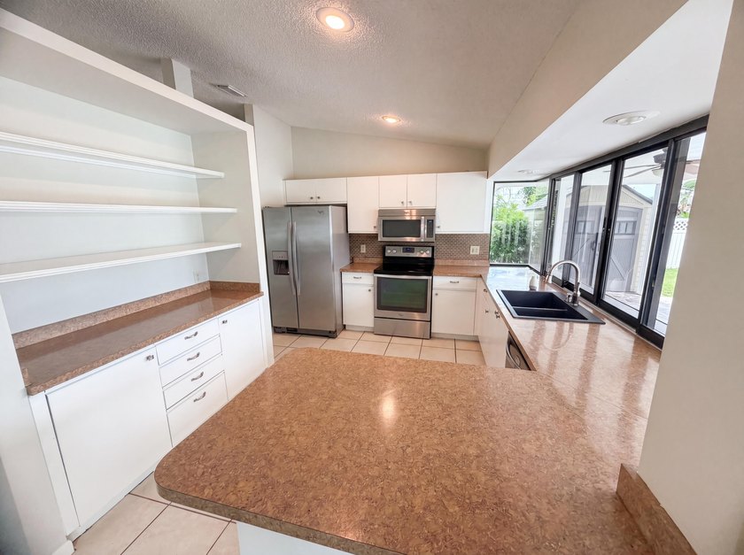 2305 SW Fern Cir is a one-story Port Saint Lucie home with a - photo 28