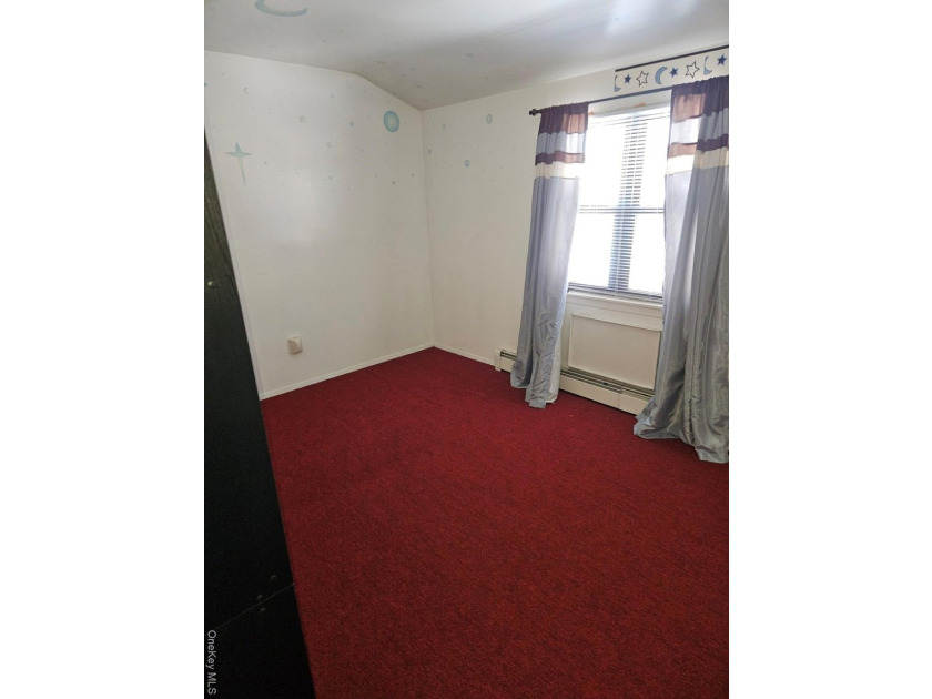 Nicely maintained 2 family home with wood floors. 1st floor has - photo 11