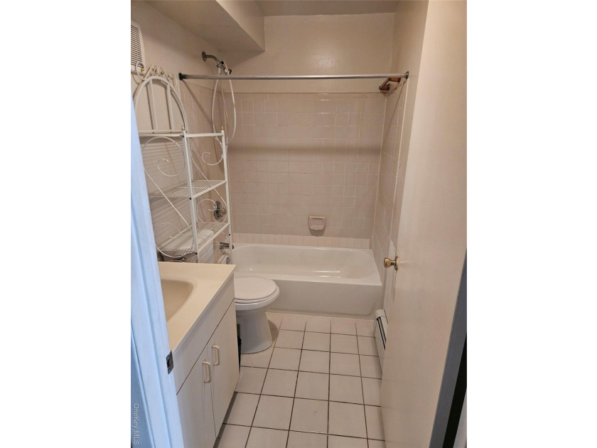 Nicely maintained 2 family home with wood floors. 1st floor has - photo 22