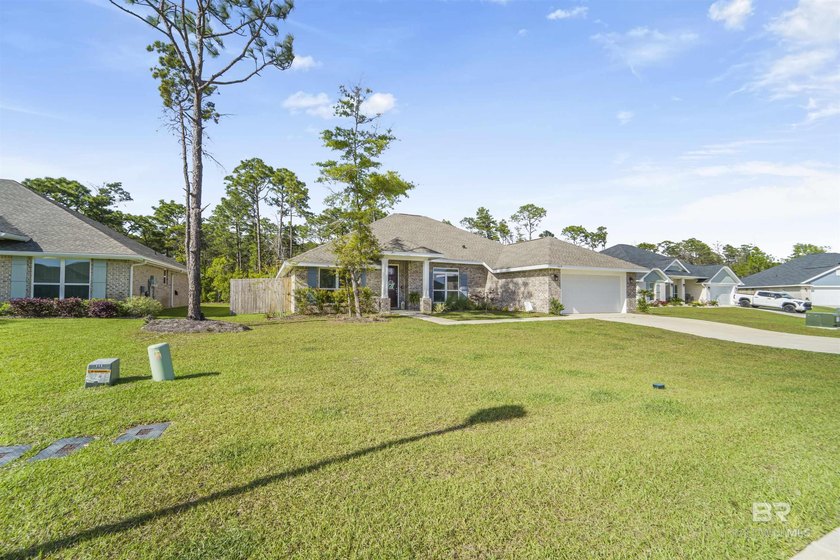 Welcome to this beautifully designed 4-bedroom, 3-bath brick - photo 2