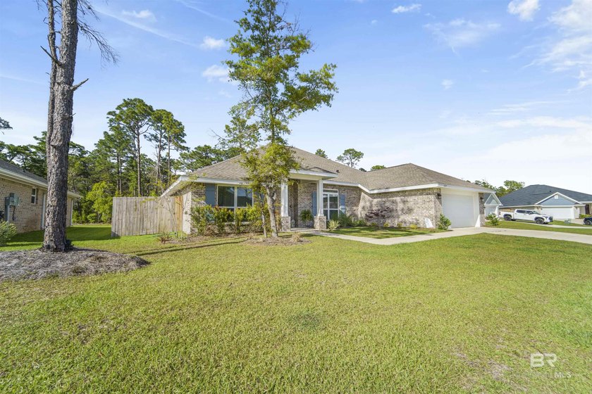Welcome to this beautifully designed 4-bedroom, 3-bath brick - photo 3