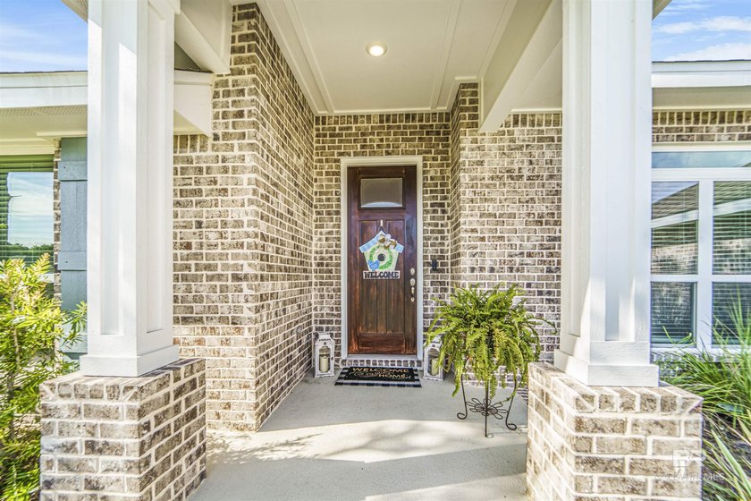 Welcome to this beautifully designed 4-bedroom, 3-bath brick - photo 5