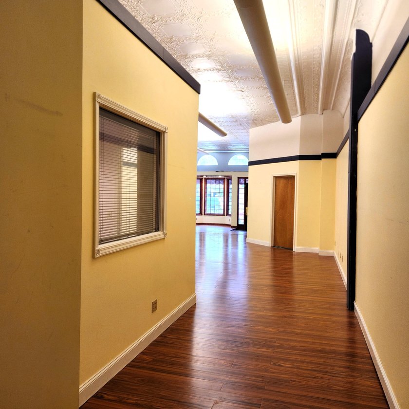 This beautiful downtown building still has original brick work - photo 20