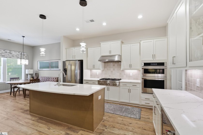 Step into effortless, single-story luxury with this pristine - photo 9