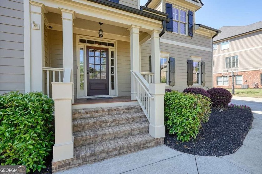 Welcome home to this move-in-ready 5BR/4BA custom home in the - photo 3