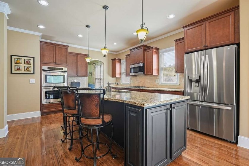 Welcome home to this move-in-ready 5BR/4BA custom home in the - photo 6