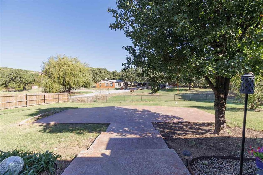 This cozy Medicine Park home has it all: Serene views of the - photo 13