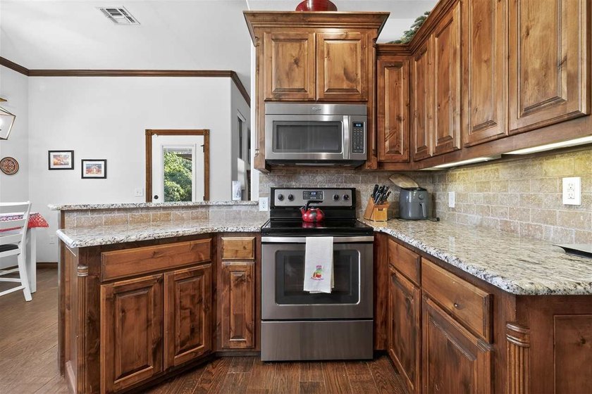 This cozy Medicine Park home has it all: Serene views of the - photo 21