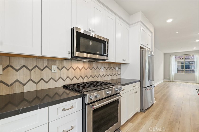 Beautifully designed 4-bedroom, 3-bathroom condo offering - photo 18