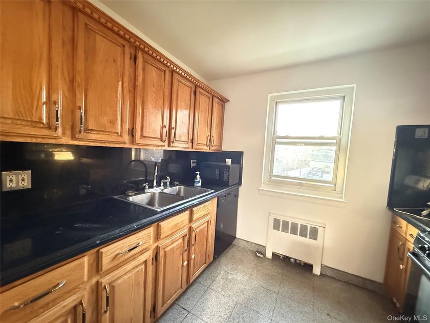 Move right into a SOUTH-facing, fully renovated, spacious, and - photo 5