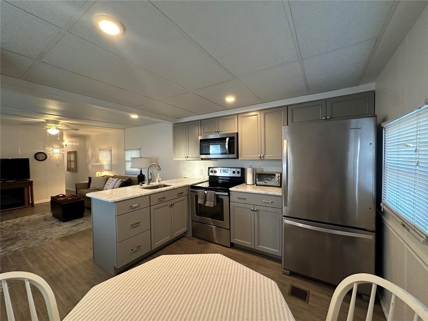 Welcome to Holiday Park! This turn-key furnished LAND-OWNED - photo 11