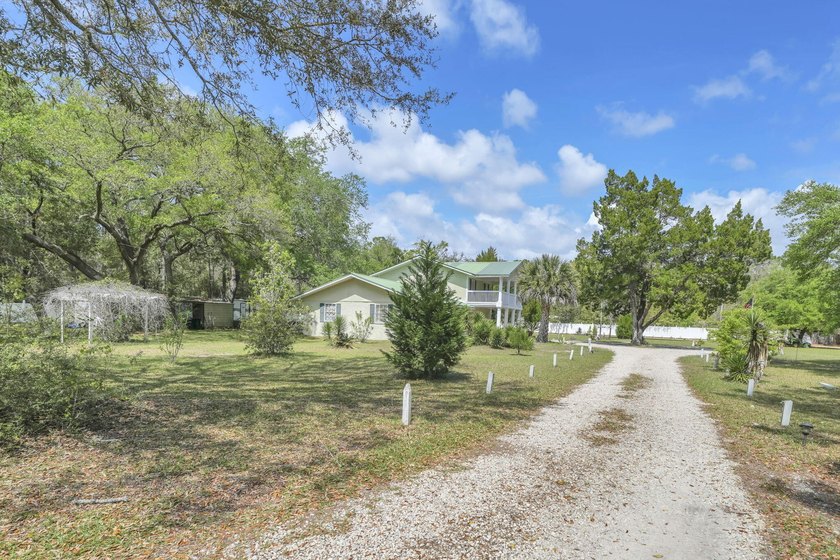 Set on 4.63 cleared acres along a paved county road, this unique - photo 32