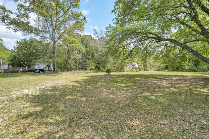 Set on 4.63 cleared acres along a paved county road, this unique - photo 33