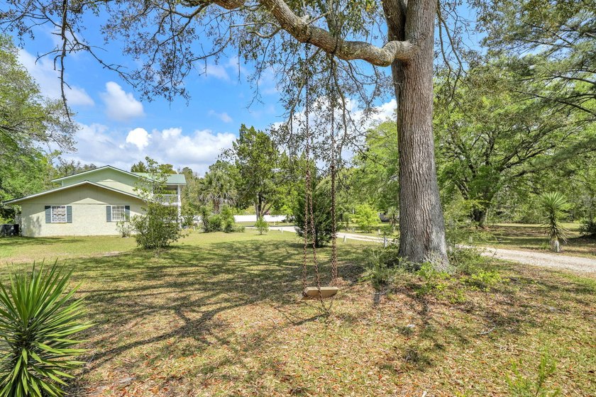 Set on 4.63 cleared acres along a paved county road, this unique - photo 38