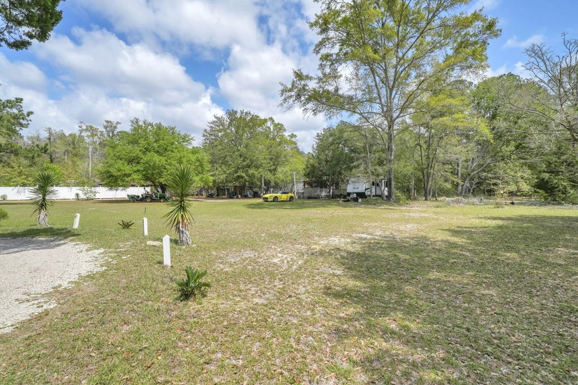 Set on 4.63 cleared acres along a paved county road, this unique - photo 40