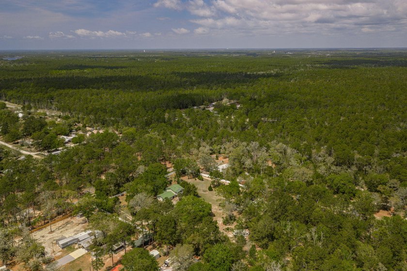 Set on 4.63 cleared acres along a paved county road, this unique - photo 49