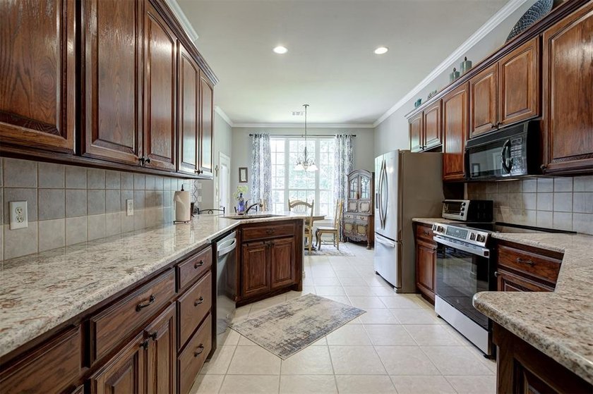 Nestled within a gated community offering a neighborhood pond - photo 12