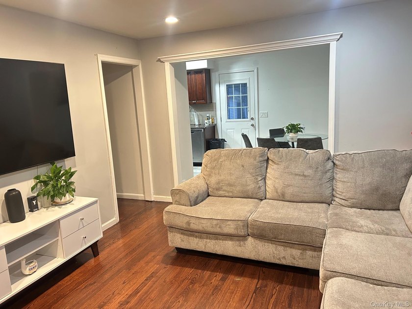 The home features a large driveway, a two-car garage, stainless - photo 5