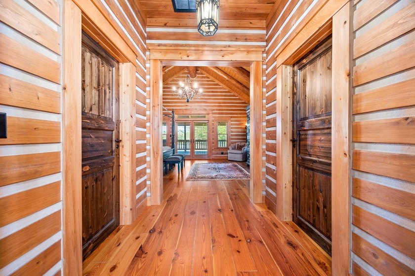 This riverfront property features an expansive, custom log home - photo 13