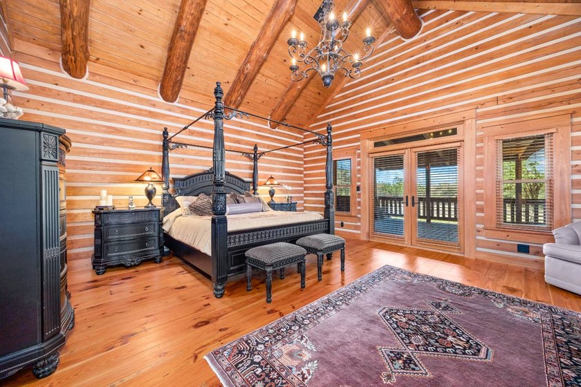 This riverfront property features an expansive, custom log home - photo 14