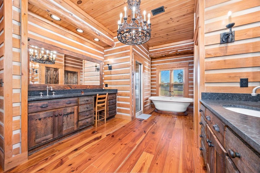 This riverfront property features an expansive, custom log home - photo 15