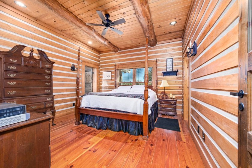 This riverfront property features an expansive, custom log home - photo 18