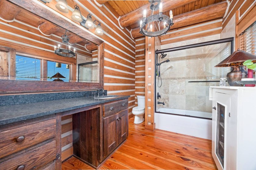 This riverfront property features an expansive, custom log home - photo 19