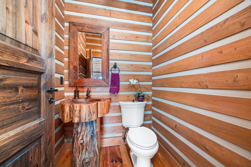 This riverfront property features an expansive, custom log home - photo 21