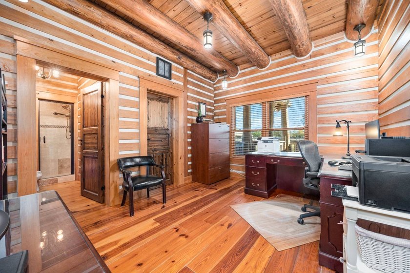This riverfront property features an expansive, custom log home - photo 23