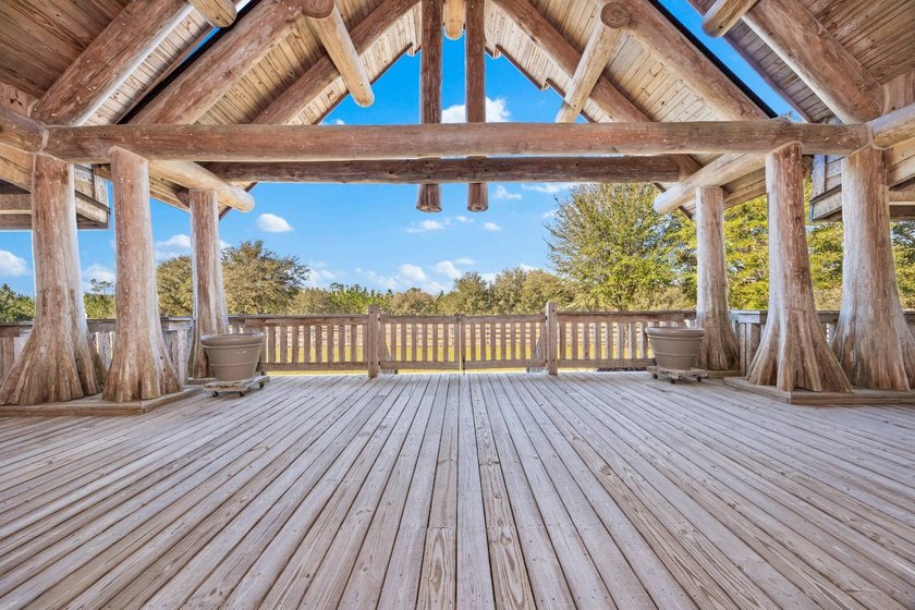 This riverfront property features an expansive, custom log home - photo 27