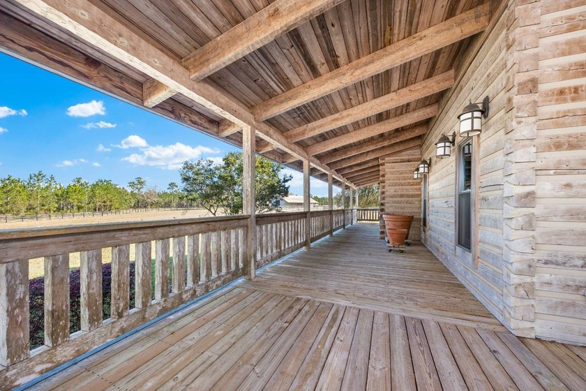 This riverfront property features an expansive, custom log home - photo 30
