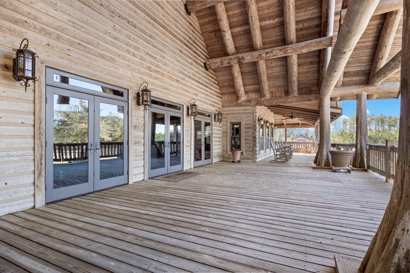 This riverfront property features an expansive, custom log home - photo 32