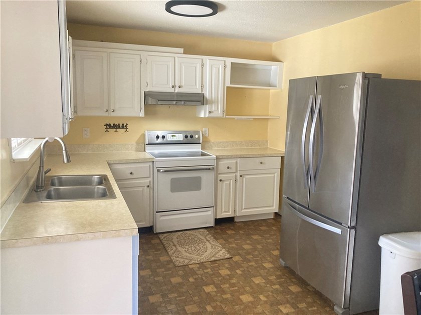 Discover the charm and potential of this spacious older home - photo 3