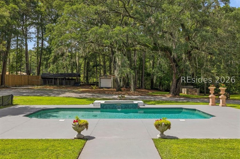 Tucked behind wrought iron gates on over four private, fenced - photo 45