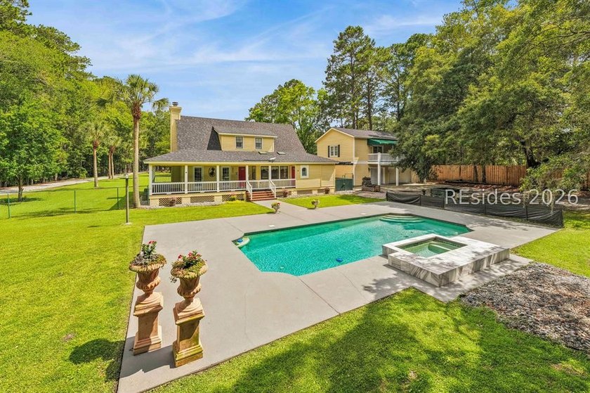 Tucked behind wrought iron gates on over four private, fenced - photo 48