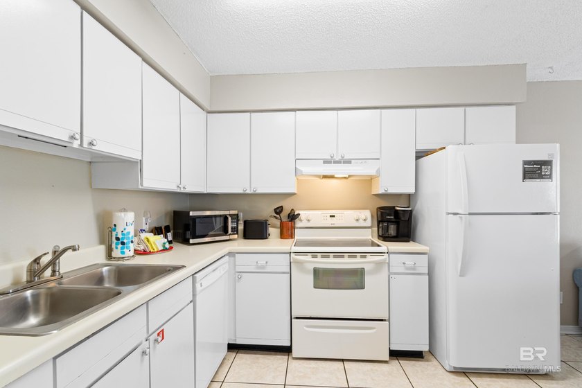 Step into easy coastal living at The Cove-a centrally located - photo 9