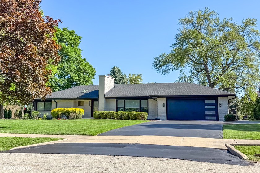 Beautifully remodeled brick ranch in a perfect location! This - photo 2