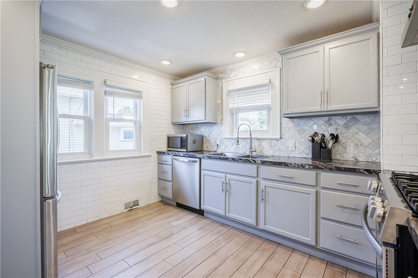 Move right into this beautifully renovated home where modern - photo 8