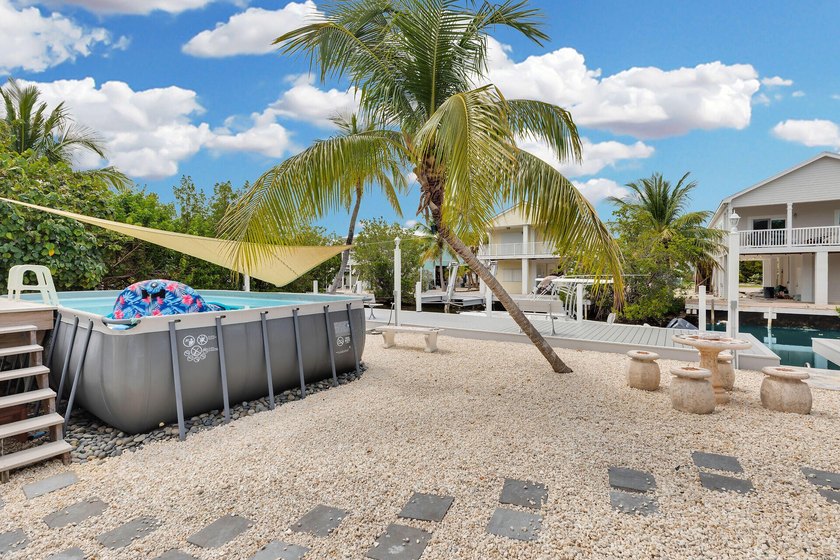 This three bedroom , two bathroom home sits on an expansive 12 - photo 22